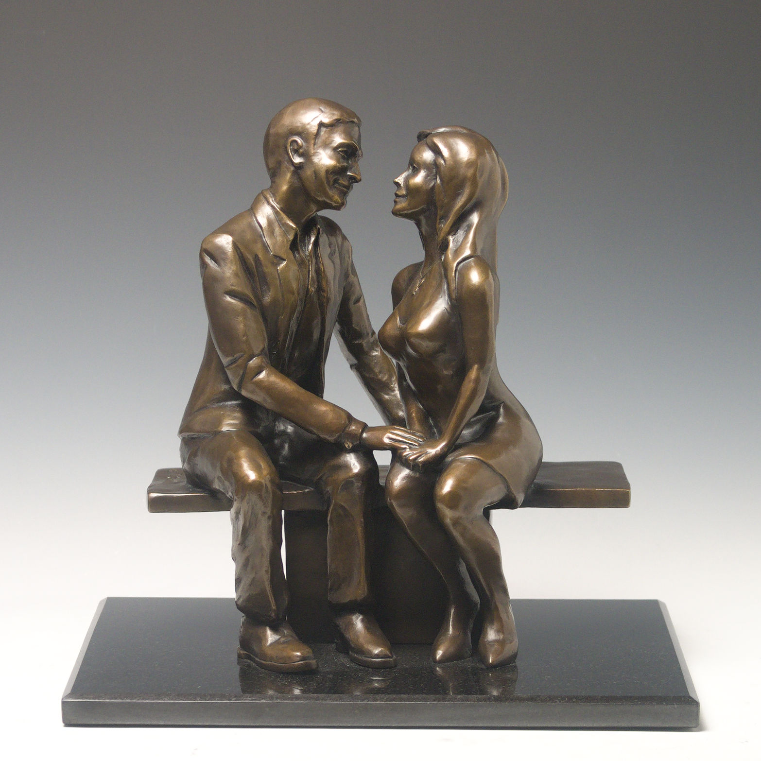 Hugh and Crystal seated on a bench custom sculpture